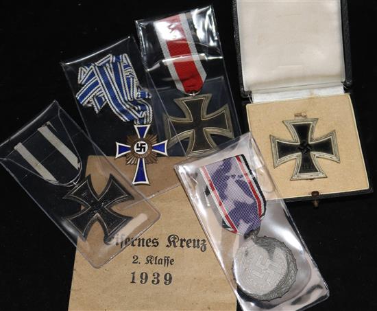 Four first and second World War iron crosses, 1st and 2nd class, and various other medals